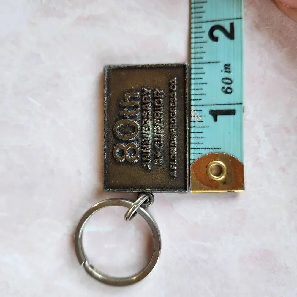 bronze vintage metal keychain plaque Florida Progress Co. 80th anniversary A+ su